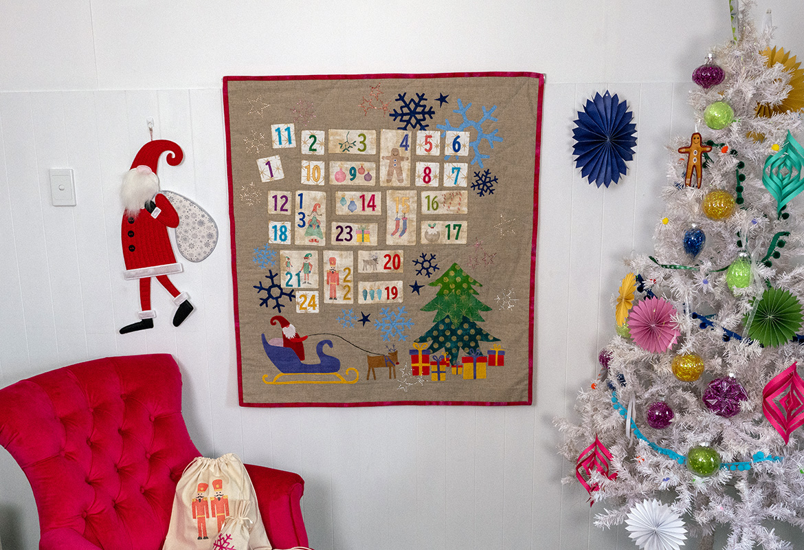 Christmas room setting with advent calendar, tree, Santa.