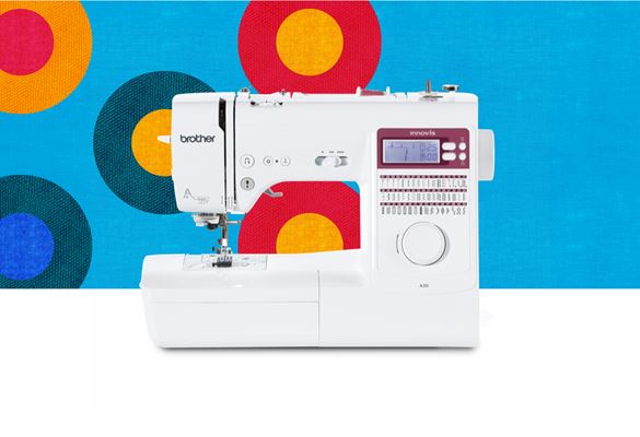 A50 sewing machine on a blue background with coloured circles