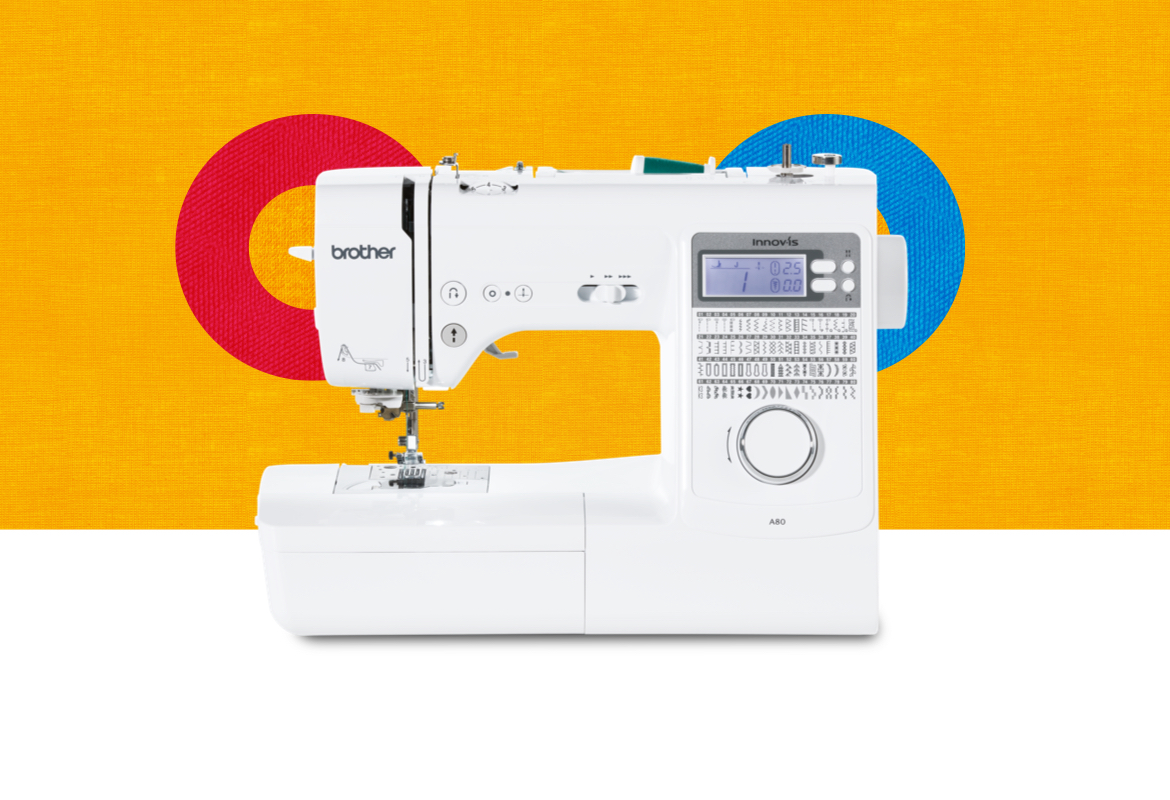 A80 sewing machine on an orange background with coloured cirlces