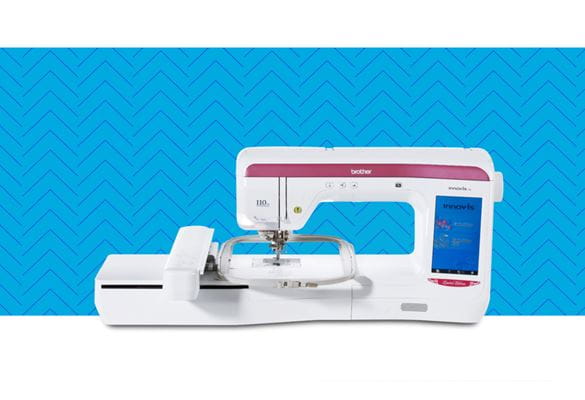 V3LE Limited Edition embroidery machine on a blue pattern background