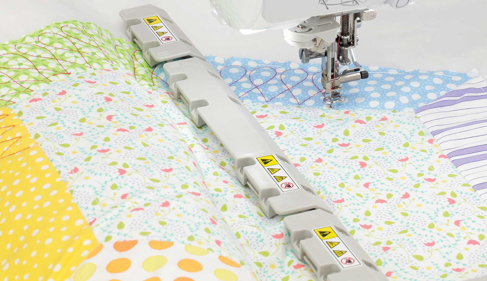 Pastel quilt and magnets of magnetic frame on light grey background