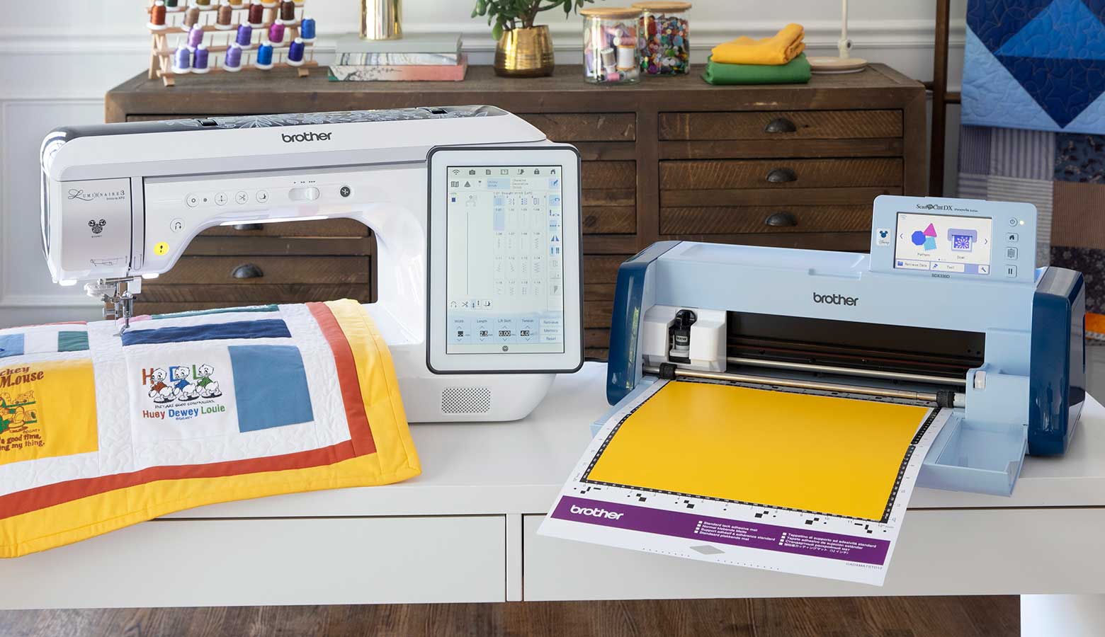 Brother embroidery and ScanNCut machine next to each other on dresser