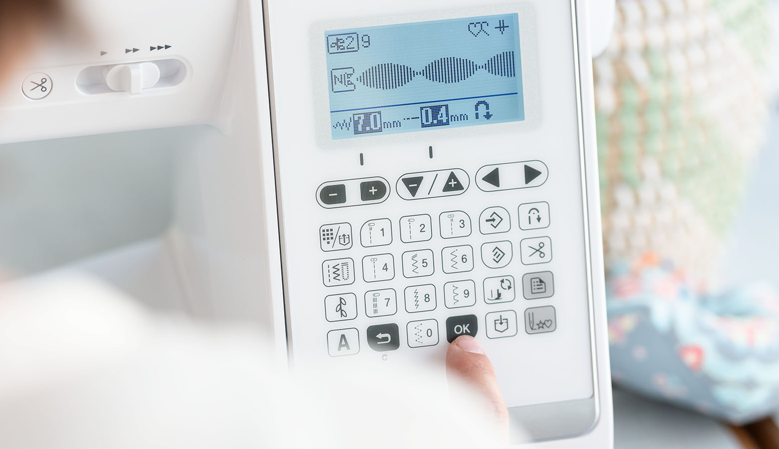 Large LCD screen and electronic keypad of Brother A150 sewing machine