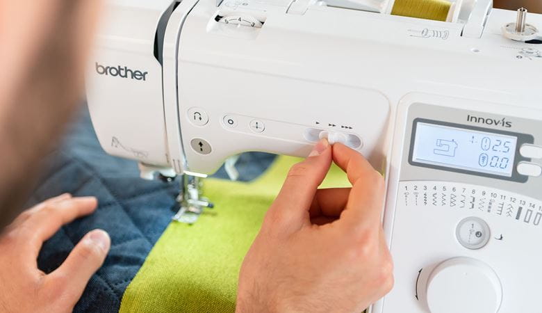 Moving the speed control slider of Brother A16 sewing machine