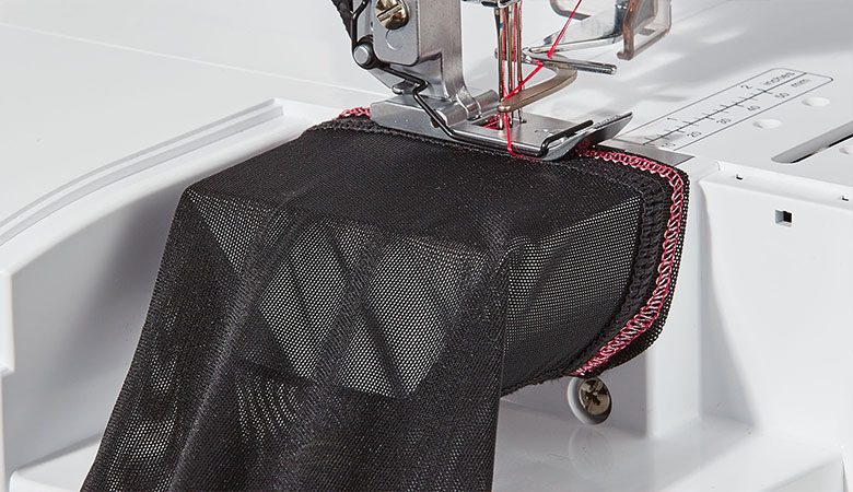 Black net fabric on free arm of Brother coverstitch machine