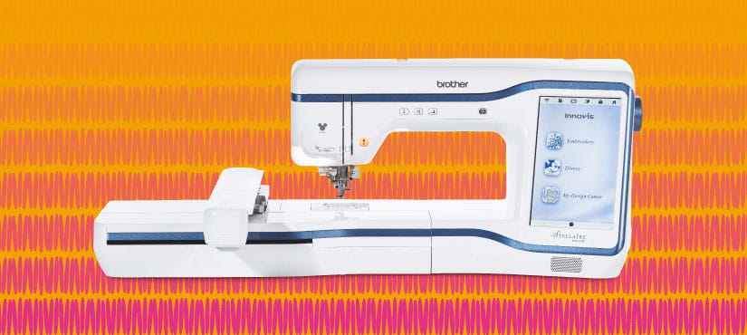 Brother Stellaire XE1 Embroidery machine on yellow and pink background