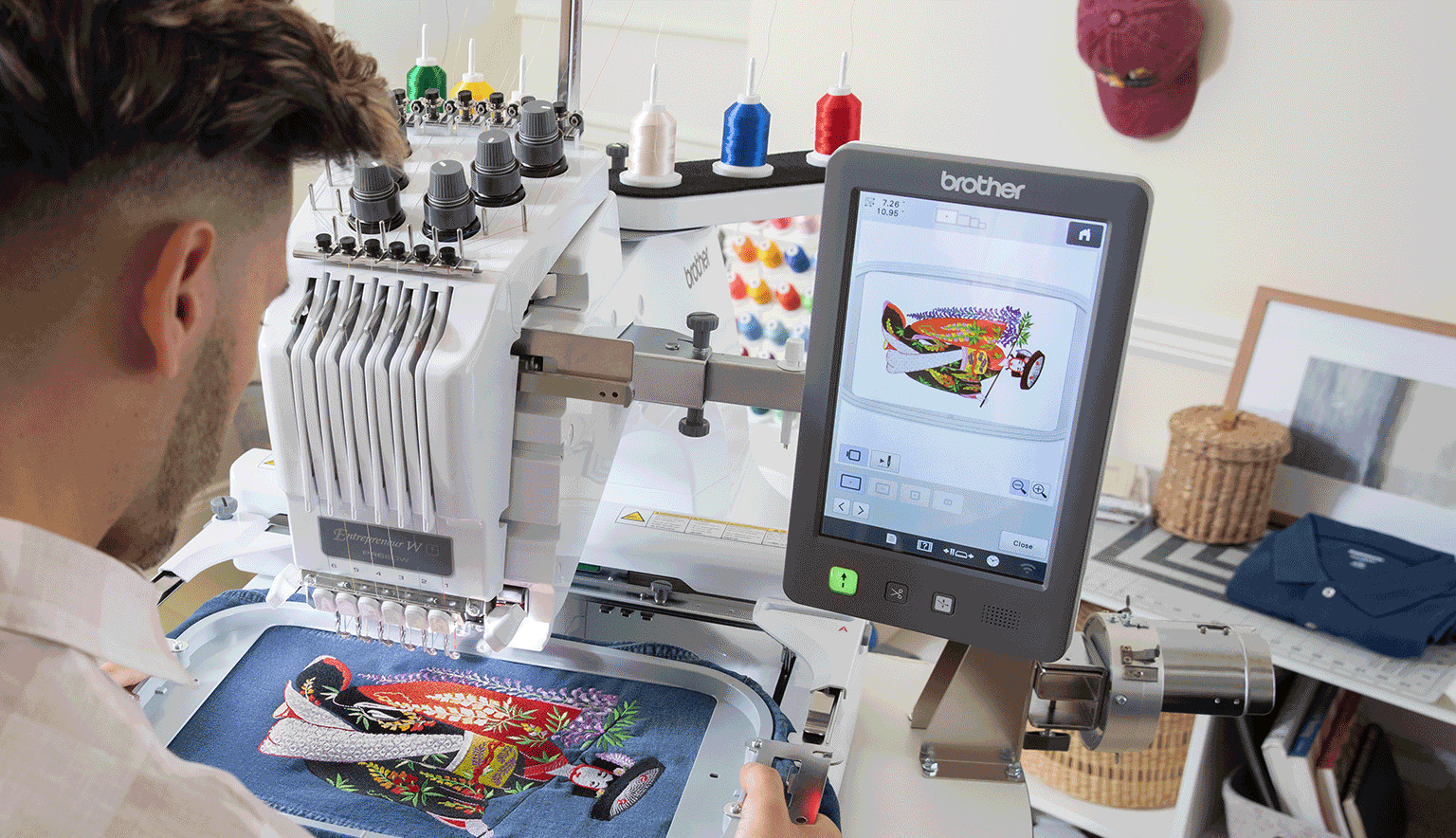 Man operating the PR680W embroidery machine