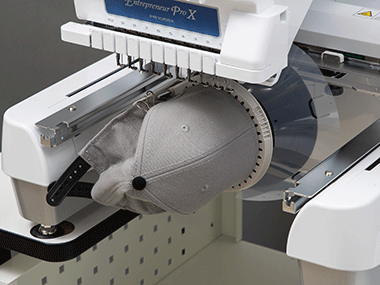 Grey and black cap in PR1055X embroidery machine