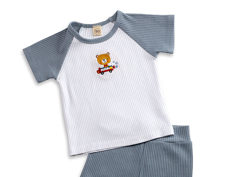 White and grey boy pajama set embroidered with a teddybear