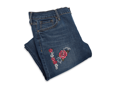 Dark denim jeans with rose embroidery design on trouser leg