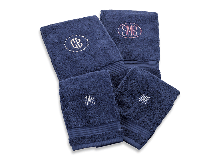 Four dark blue monogrammed embroidered towels