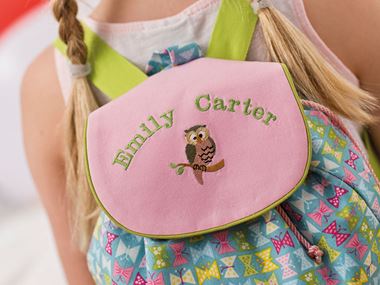 Pink backpack with Emily Carter and an owl embroidered