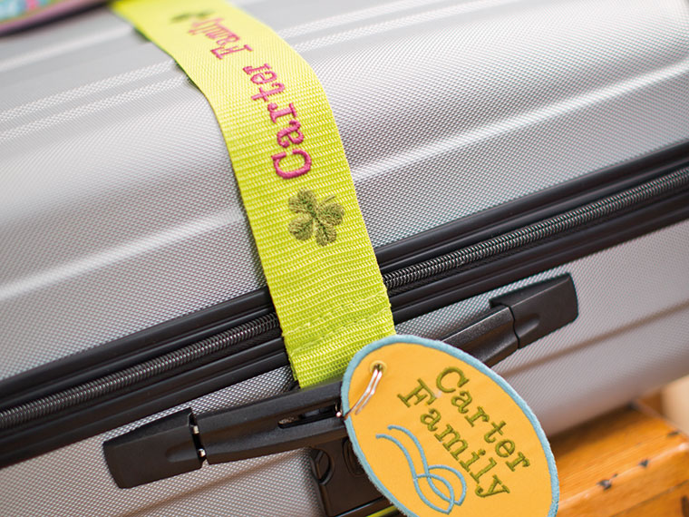 Yellow suitcase belt with embroidery on
