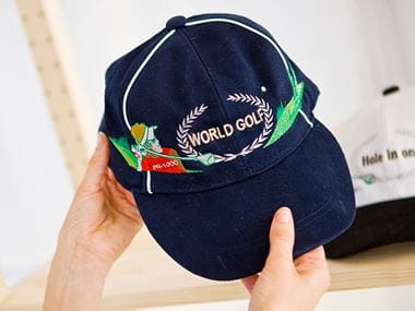 Navy cap embroidered with World Golf sign