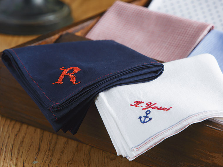 Blue and white handkerchief with embroidered letters