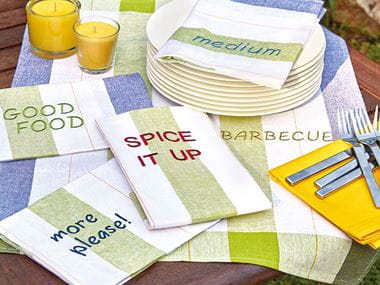 Fabric napkins with different words embroidered on