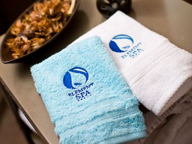 White and blue embroidered towels