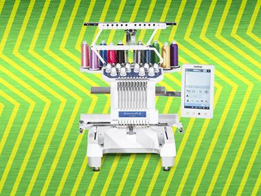 Pr1055X embroidery machine on green zigzag background