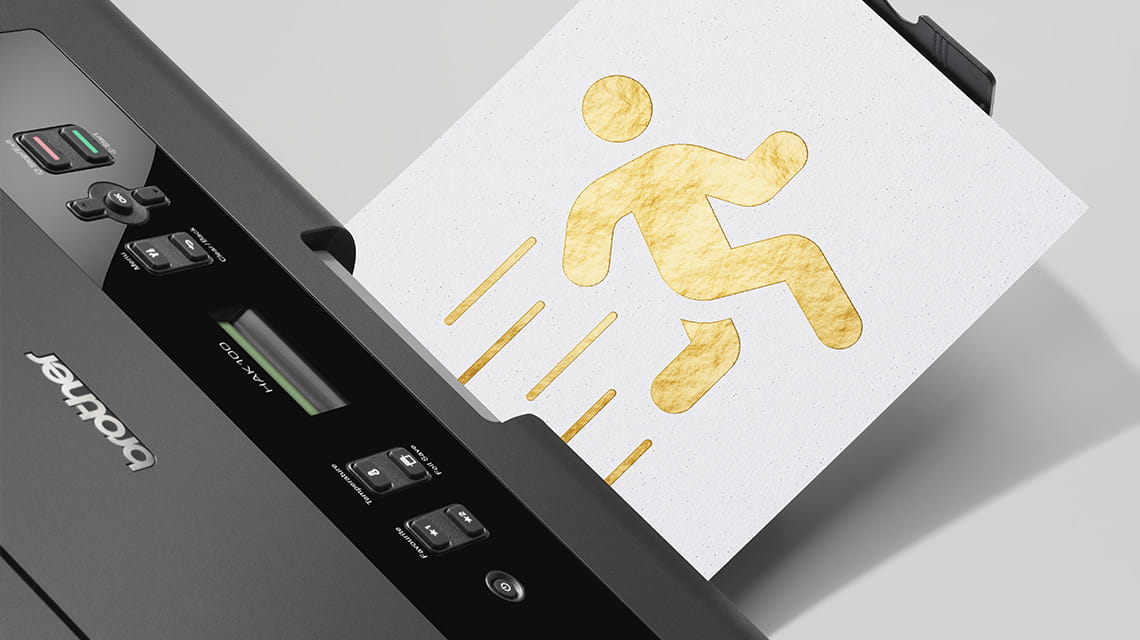 HAK hot foil printer prints white sheet of paper with gold foil