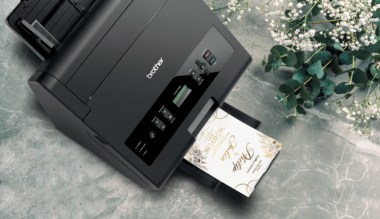 Brother foil printer at wedding setting printing invitation