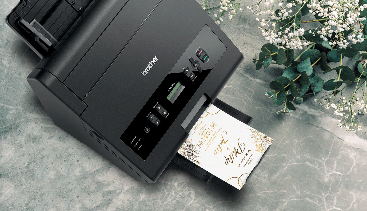 Brother foil printer at wedding setting printing invitation